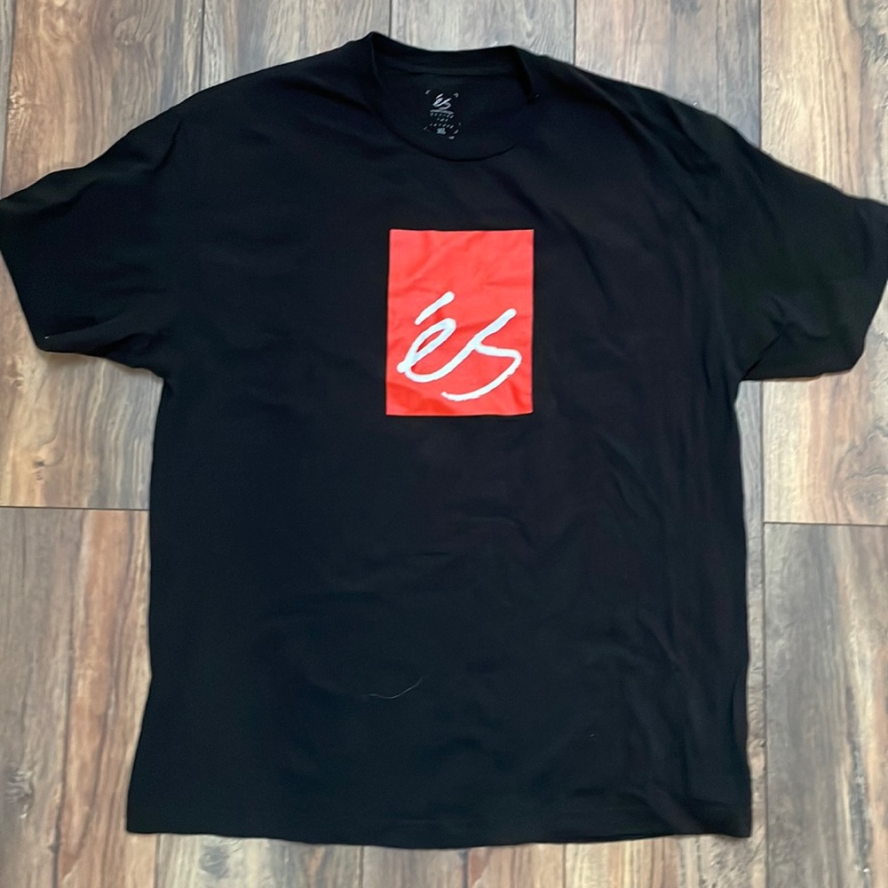 Black ES skateboarding shirt.